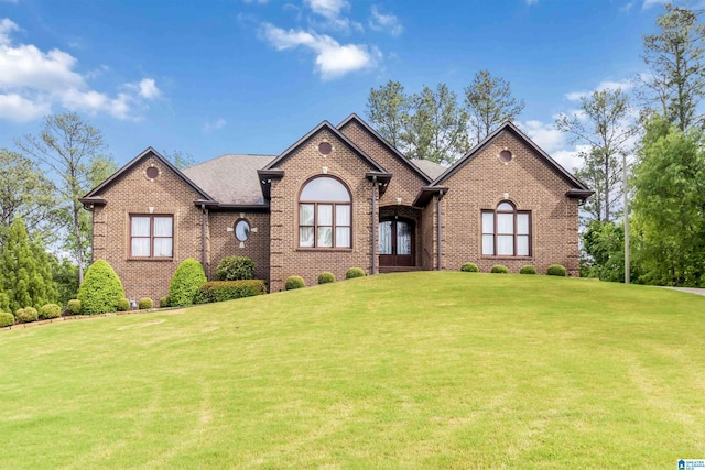 131 Creekwater St, Helena, AL 35080 - ranch-style home with roof with shingles, a front yard, and brick siding