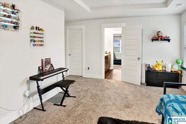 carpeted bedroom featuring visible vents and baseboards