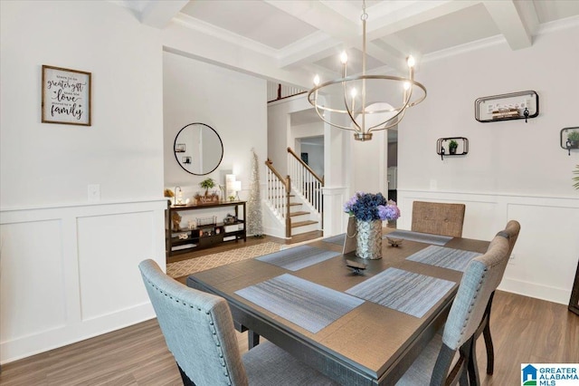 dining room with beam ceiling, a decorative wall, and coffered ceiling