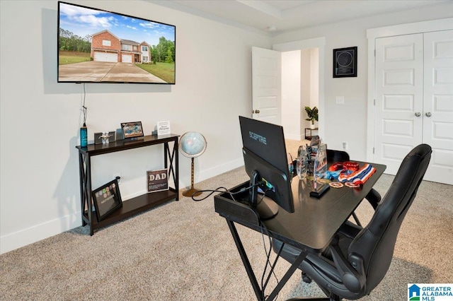 home office featuring carpet and baseboards
