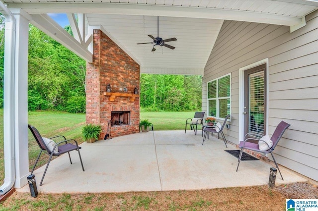 view of patio / terrace featuring a ceiling fan and an outdoor brick fireplace