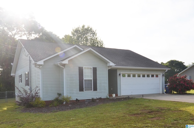 ranch-style house with driveway, a shingled roof, an attached garage, fence, and a front lawn