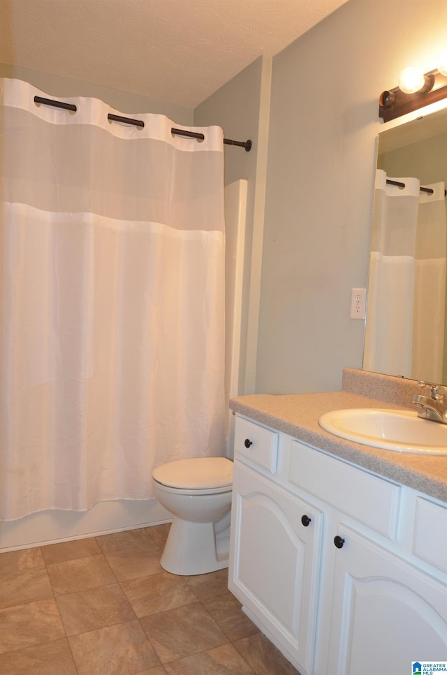 bathroom with toilet, shower / bath combination with curtain, and vanity