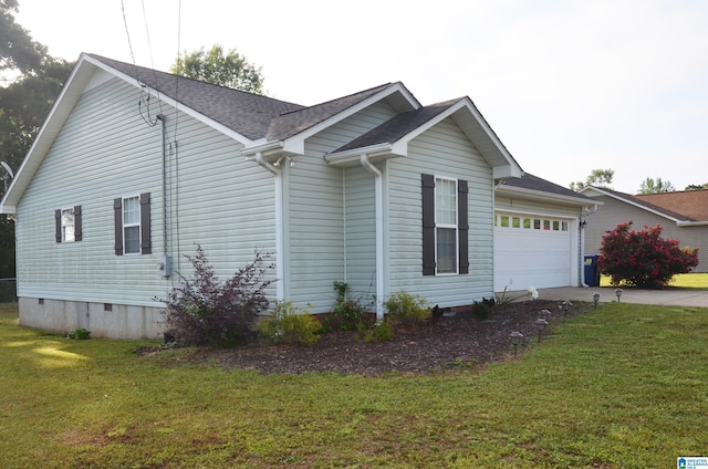 view of side of home featuring a yard, a garage, crawl space, driveway, and roof with shingles