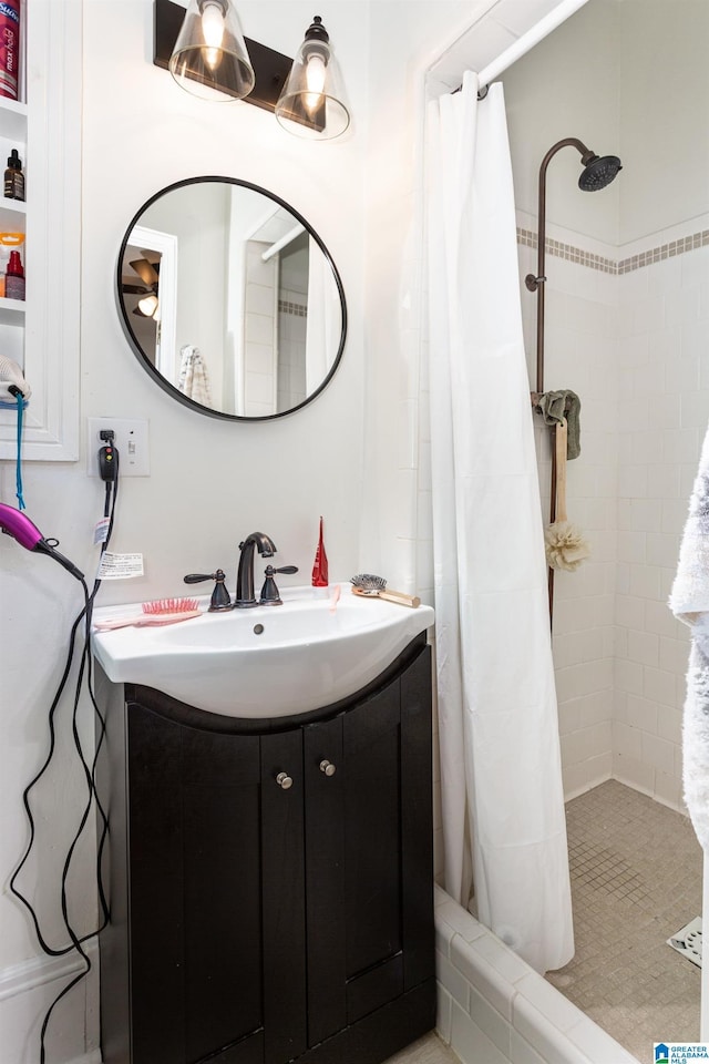 full bath featuring vanity and a shower stall