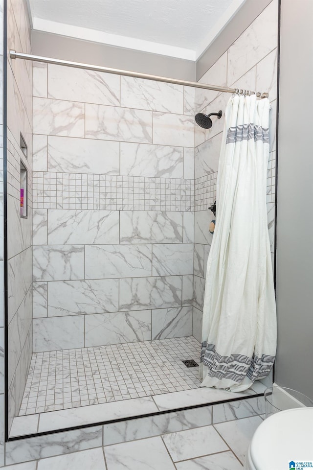 full bath featuring toilet, marble finish floor, and a shower stall