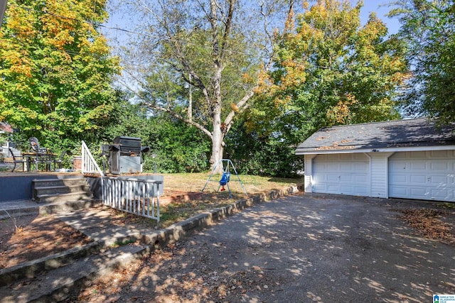 exterior space featuring an outbuilding and a garage