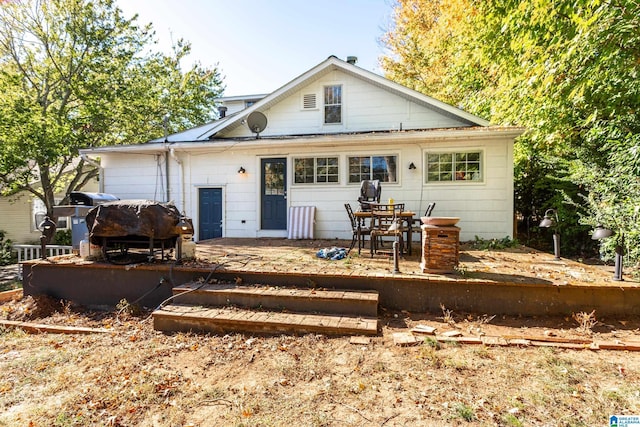 back of house featuring a deck
