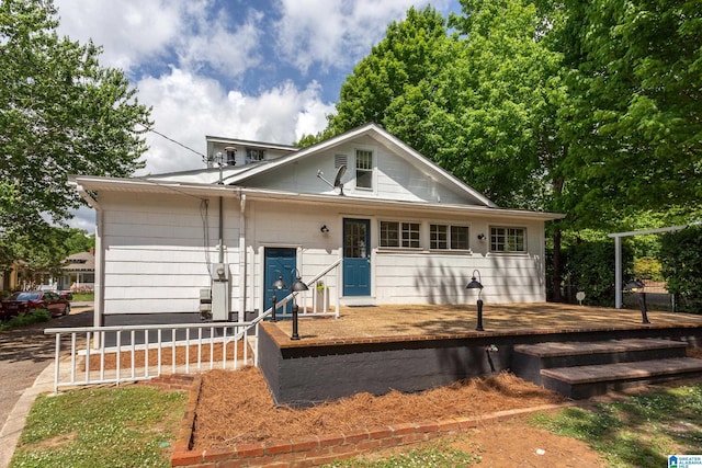 bungalow with a wooden deck