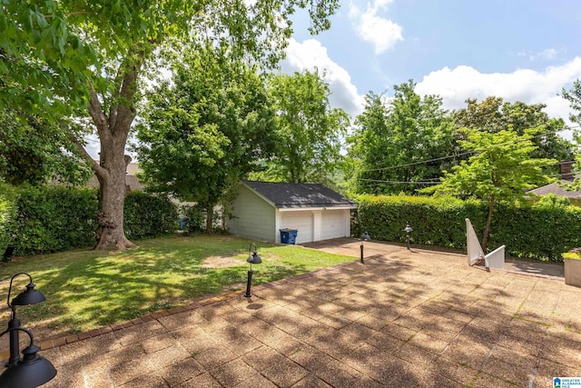 wooden deck featuring a lawn, an outdoor structure, and a garage
