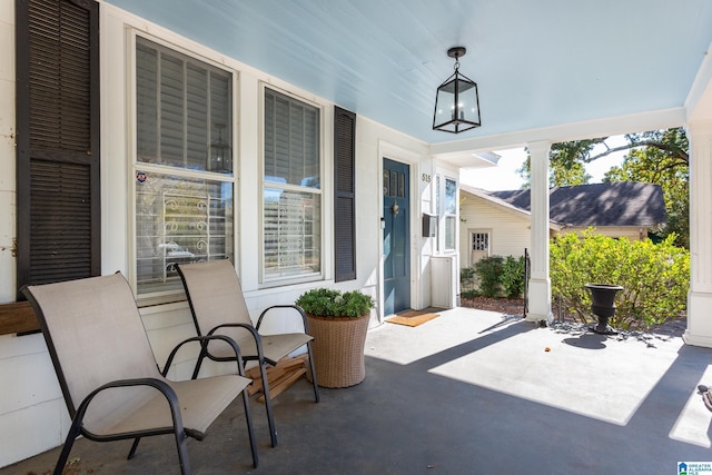 view of patio featuring a porch