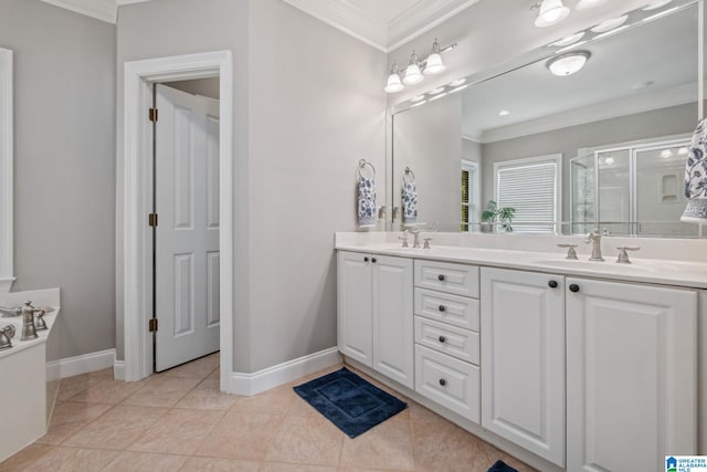 bathroom with crown molding, double vanity, a sink, and a stall shower
