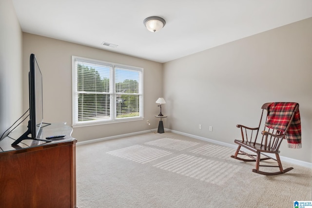 unfurnished room with baseboards, light carpet, and visible vents