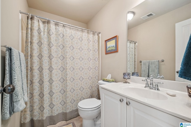 bathroom featuring vanity, a shower with curtain, toilet, and visible vents