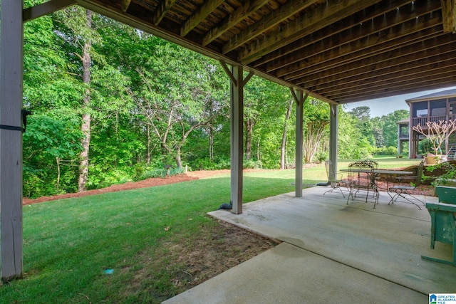 view of yard featuring a patio and outdoor dining space