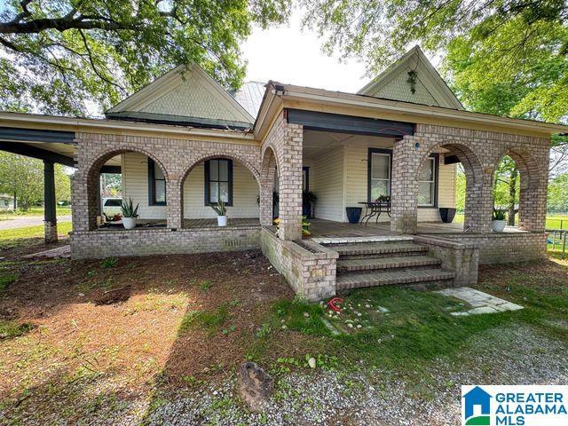 back of property featuring a porch