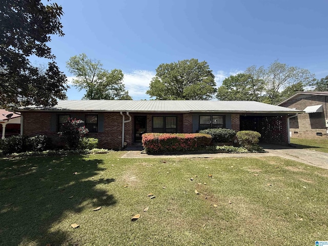 single story home featuring brick siding, metal roof, a carport, a front yard, and concrete driveway