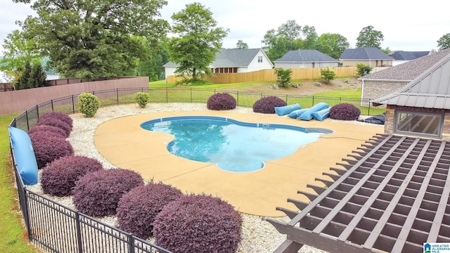 view of swimming pool with a fenced backyard, a patio area, and a fenced in pool