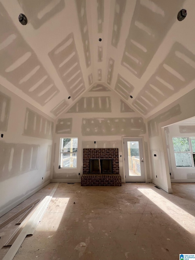 190 Estates Club Dr, Pell City, AL 35128 - unfurnished living room with high vaulted ceiling and a fireplace