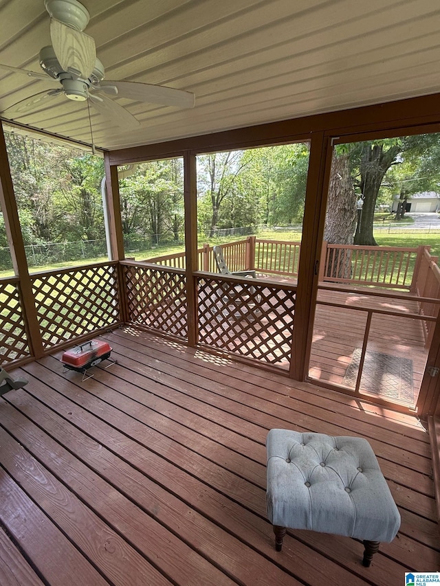 wooden terrace featuring ceiling fan