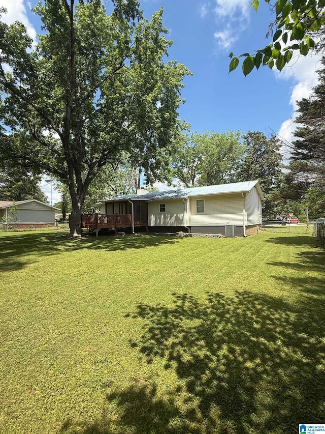 view of yard with a wooden deck
