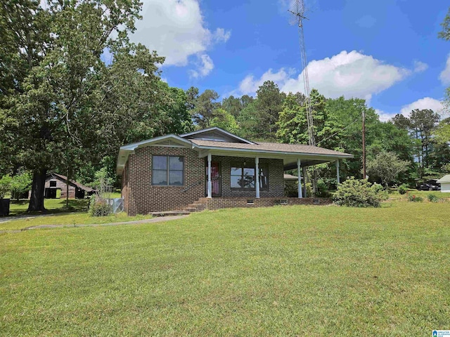 576 Chandler Mountain Rd, Steele, AL 35987 - view of front of home featuring a porch, a carport, a front yard, and brick siding