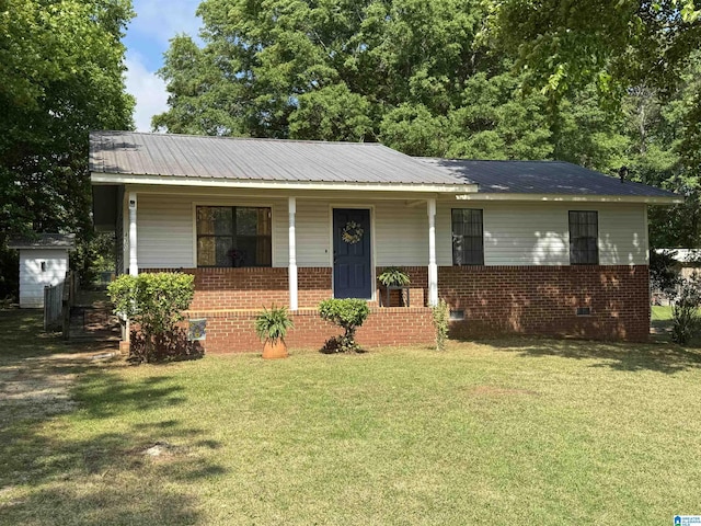 ranch-style home featuring brick siding, a porch, crawl space, and a front lawn