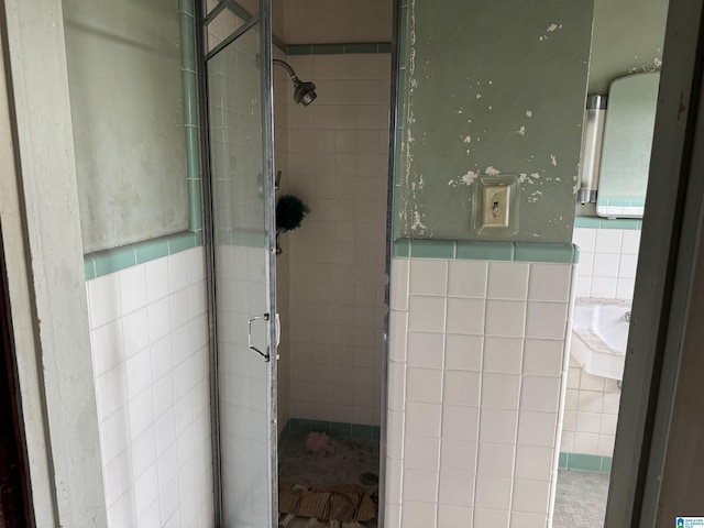 2030 Leighton Ave, Anniston, AL 36207 - full bathroom with a sink, a stall shower, and tile walls