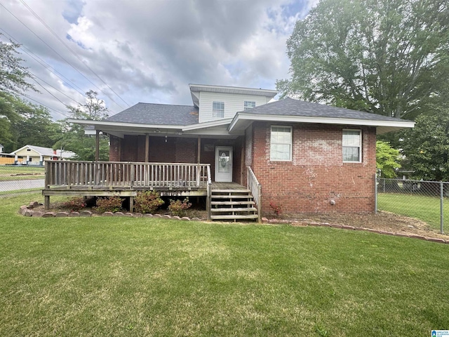 2030 Leighton Ave, Anniston, AL 36207 - view of front facade featuring a shingled roof, brick siding, fence, and a front lawn