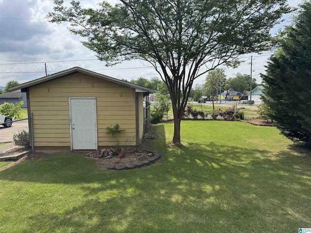 2030 Leighton Ave, Anniston, AL 36207 - view of outdoor structure featuring fence and an outbuilding