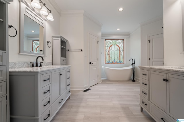 2004 Shandwick Ter, Birmingham, AL 35242 - bathroom with crown molding, a freestanding bath, a healthy amount of sunlight, and vanity