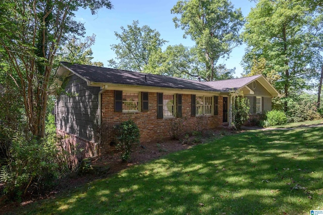1426 Overlook Rd, Homewood, AL 35209 - view of side of home featuring a lawn and brick siding