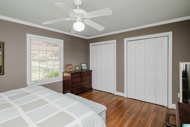 1426 Overlook Rd, Homewood, AL 35209 - bedroom with wood finished floors, multiple closets, a ceiling fan, and ornamental molding
