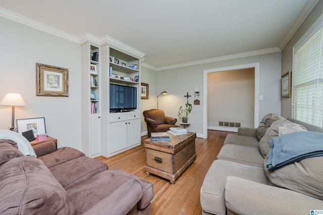 1426 Overlook Rd, Homewood, AL 35209 - living room with crown molding, visible vents, baseboards, and light wood-type flooring