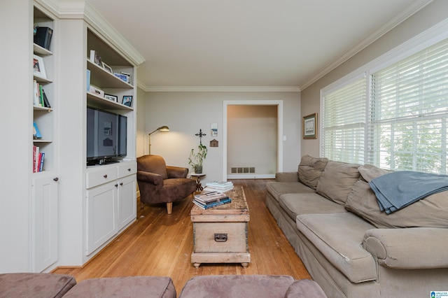 1426 Overlook Rd, Homewood, AL 35209 - living room featuring ornamental molding, visible vents, and light wood-style flooring