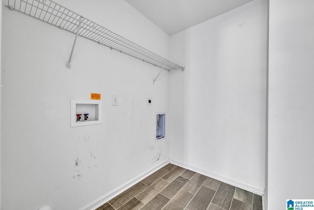 1291 Archers Cove Ln, Springville, AL 35146 - washroom featuring hookup for an electric dryer, dark wood-type flooring, hookup for a washing machine, and baseboards