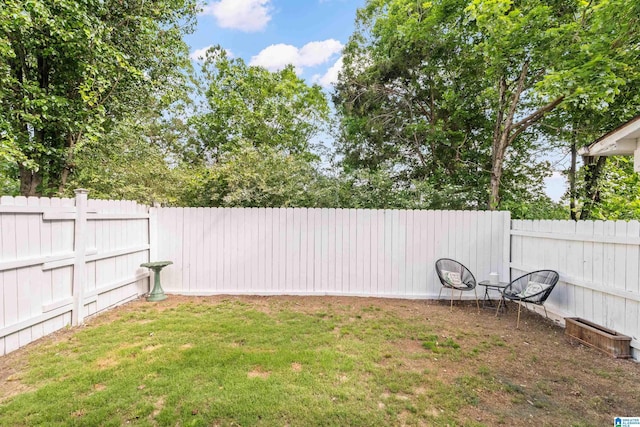 view of yard with a fenced backyard
