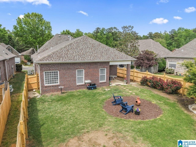 209 Vineyard Ln, Birmingham, AL 35242 - rear view of house with roof with shingles, brick siding, a fenced backyard, a patio area, and a lawn