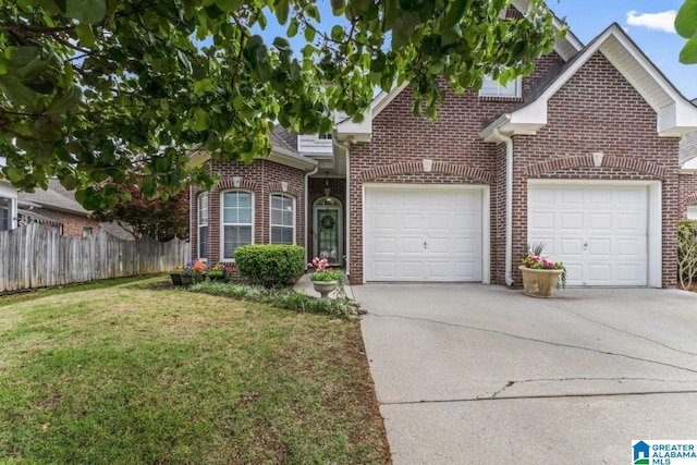 209 Vineyard Ln, Birmingham, AL 35242 - view of front facade featuring brick siding, fence, a front lawn, concrete driveway, and an attached garage