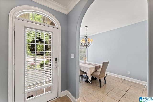 209 Vineyard Ln, Birmingham, AL 35242 - entryway featuring crown molding, a notable chandelier, arched walkways, baseboards, and light tile patterned floors