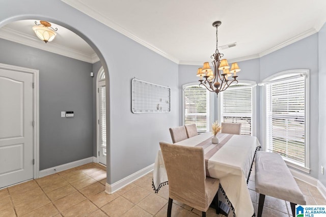 209 Vineyard Ln, Birmingham, AL 35242 - dining area featuring arched walkways, baseboards, a chandelier, ornamental molding, and light tile patterned flooring