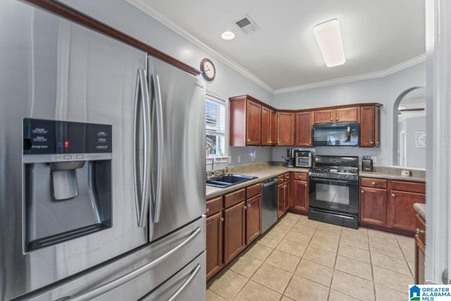 209 Vineyard Ln, Birmingham, AL 35242 - kitchen with crown molding, light countertops, a sink, light tile patterned floors, and black appliances