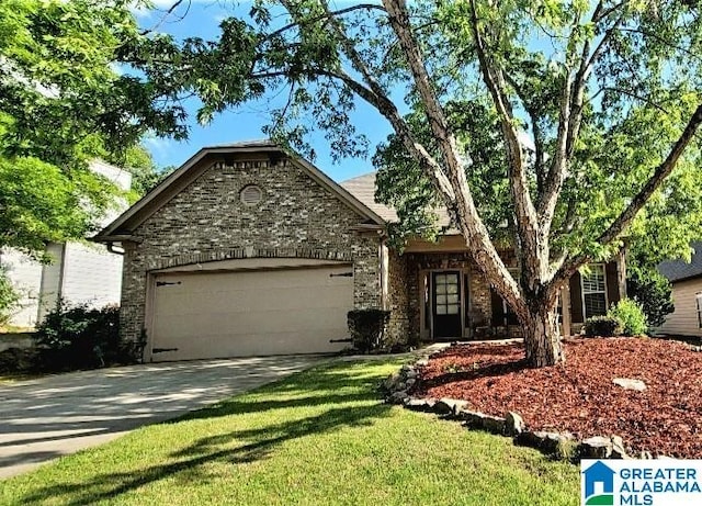 view of front of home featuring a garage, driveway, a front lawn, and stone siding