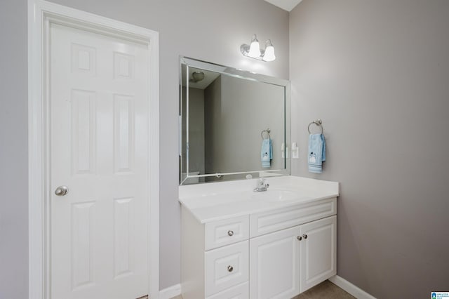 bathroom with vanity and baseboards