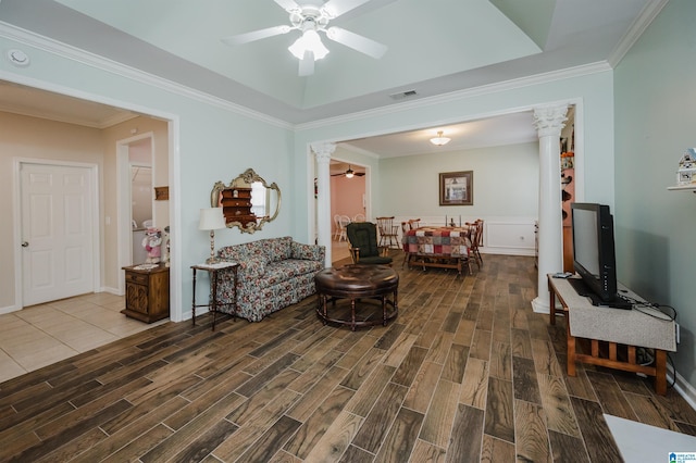 living room featuring visible vents, ornamental molding, decorative columns, wood finished floors, and ceiling fan
