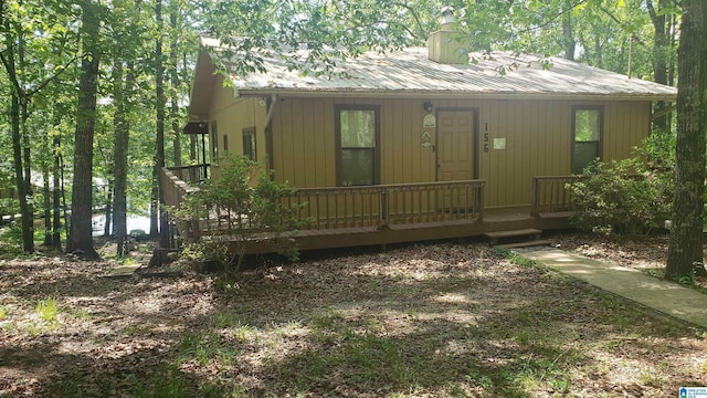 view of front of house featuring covered porch and metal roof