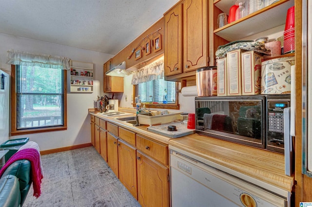 156 Wallace Dr, Shelby, AL 35143 - kitchen featuring white dishwasher, light countertops, black microwave, baseboards, and a textured ceiling