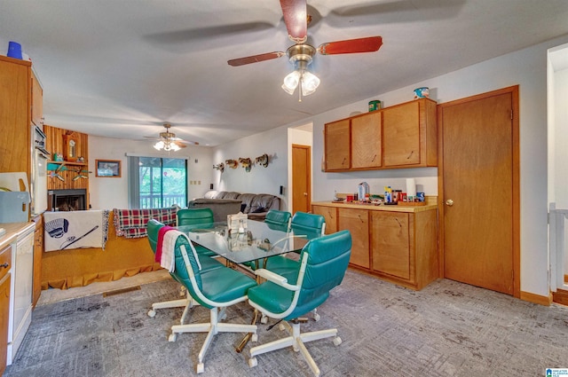156 Wallace Dr, Shelby, AL 35143 - dining room featuring ceiling fan, a large fireplace, and light colored carpet