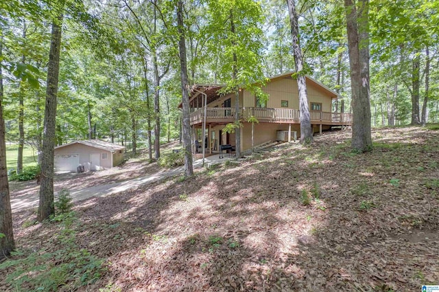 156 Wallace Dr, Shelby, AL 35143 - view of property exterior featuring a wooden deck, an outdoor structure, and a detached garage