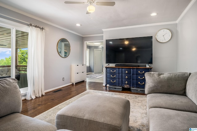 living room with crown molding, ceiling fan, dark wood finished floors, baseboards, and visible vents